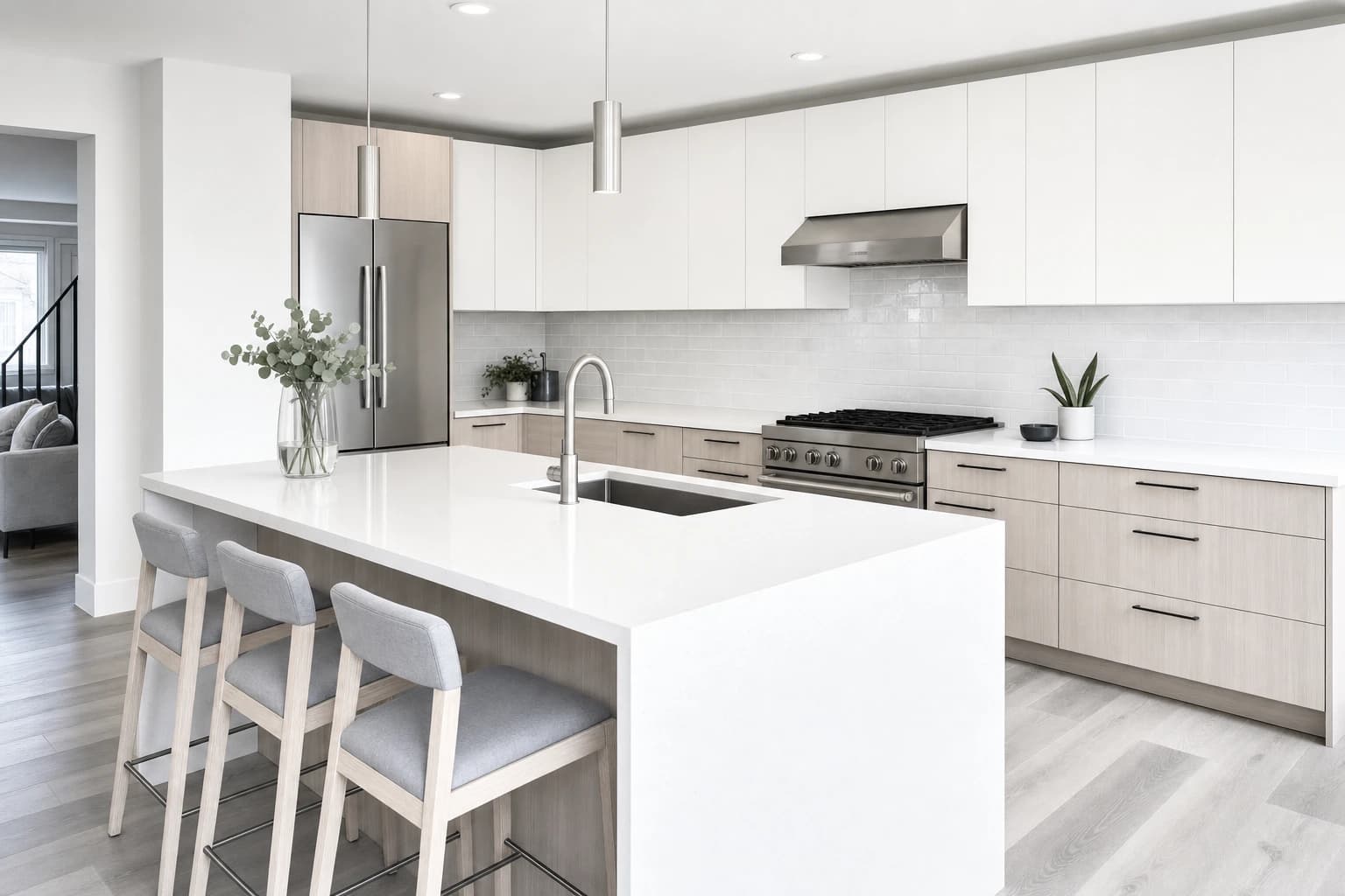 White quartz island and pale oak cabinets in a budget Sacramento kitchen remodel